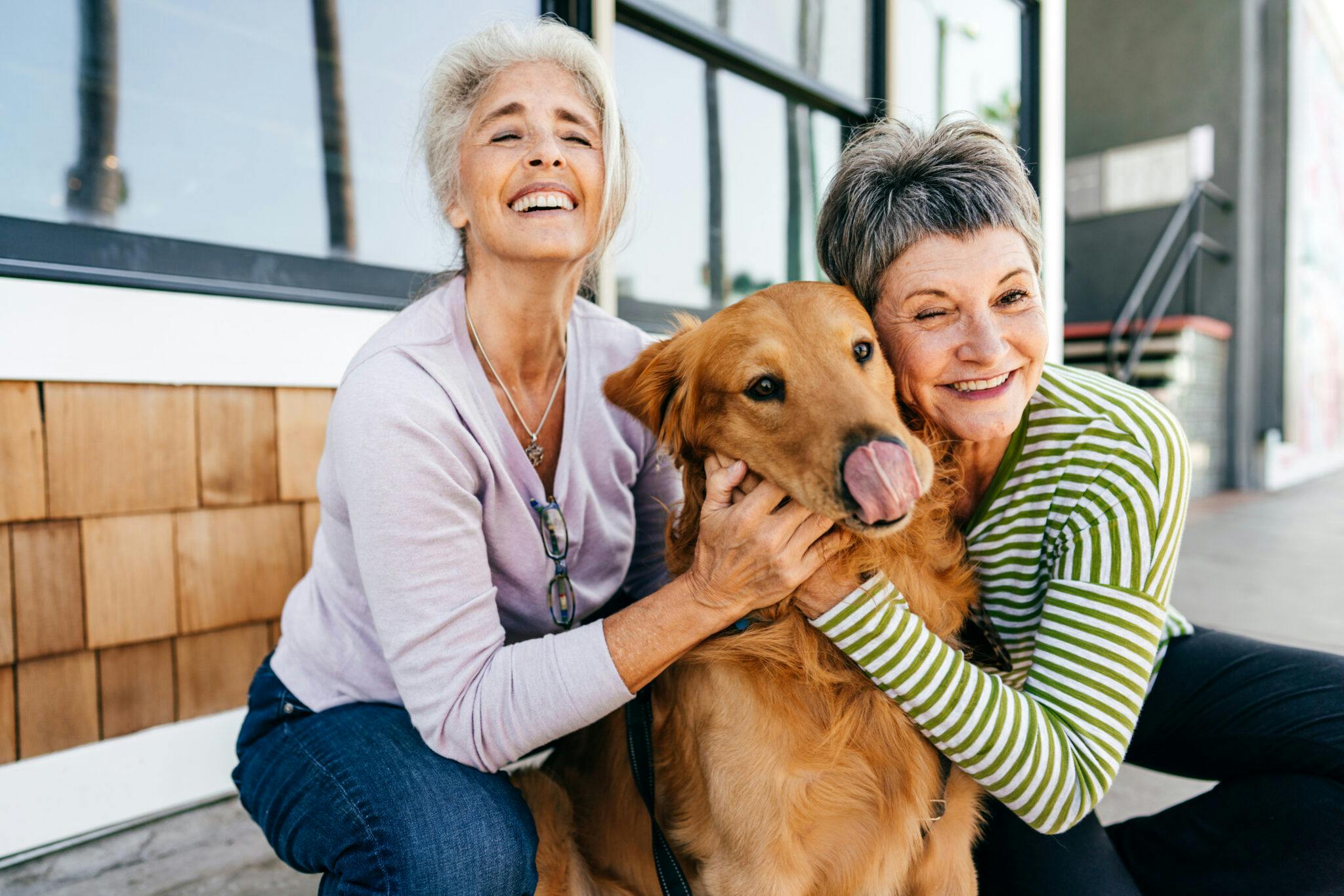 Senior ladies hugging a dog.jpg